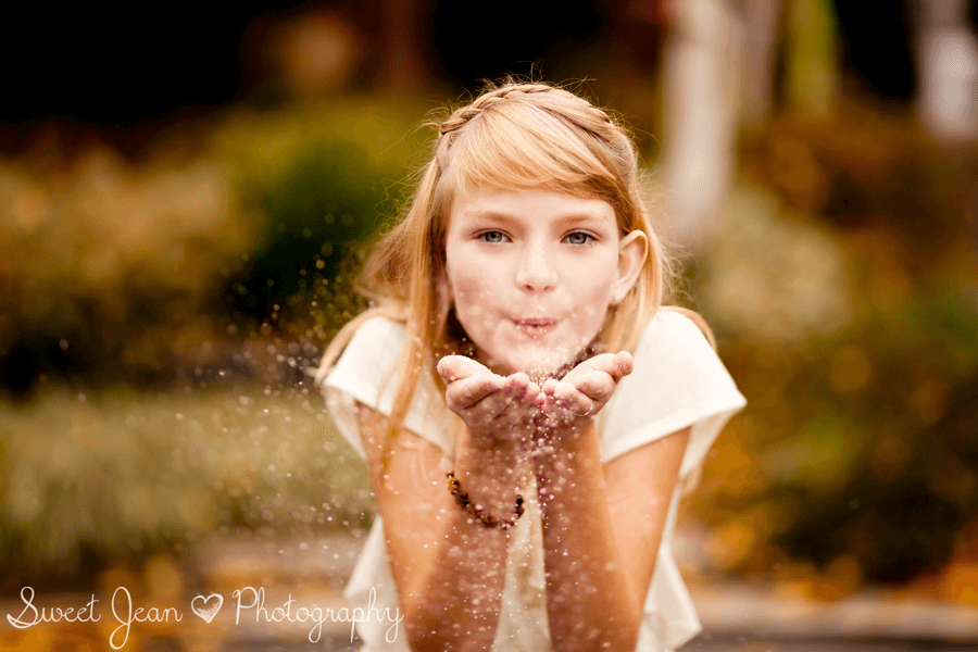 GIrl blowing glitter