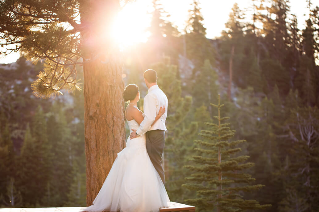 bride and groom gazing into the tahoe sunset