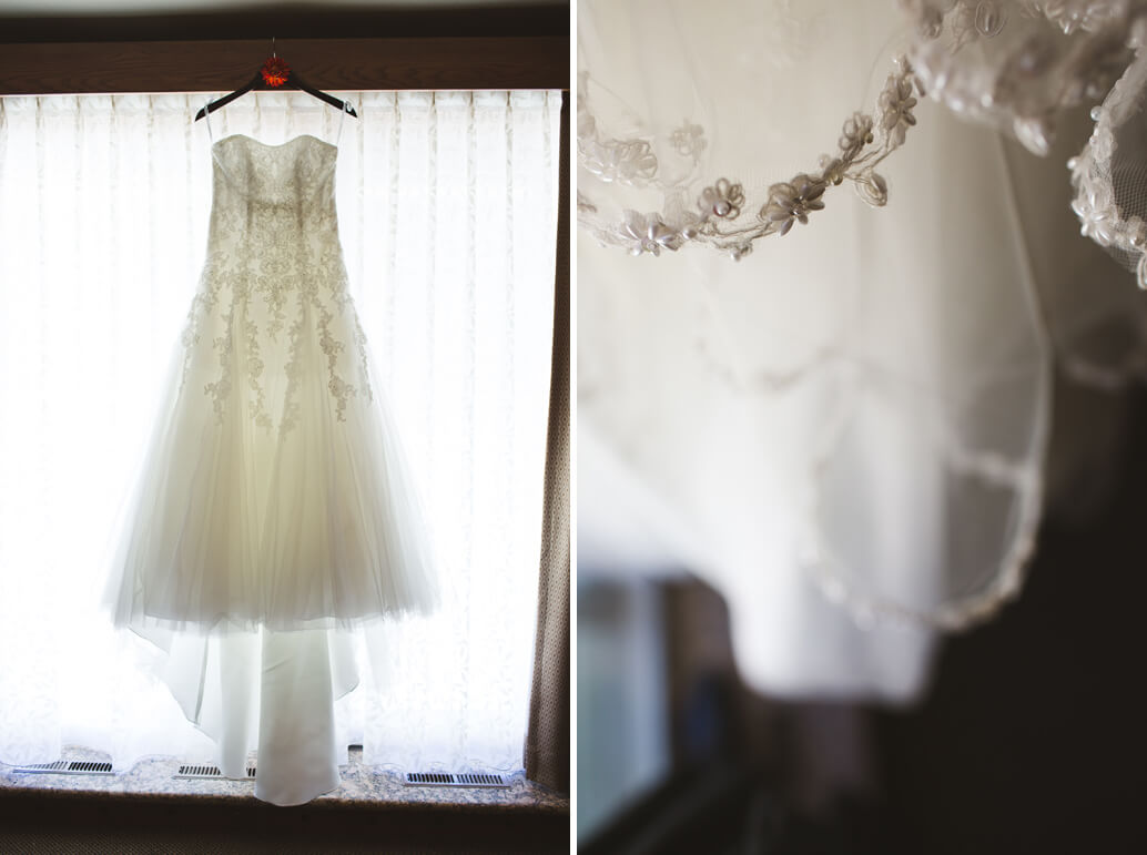 wedding dress hanging in window with details 