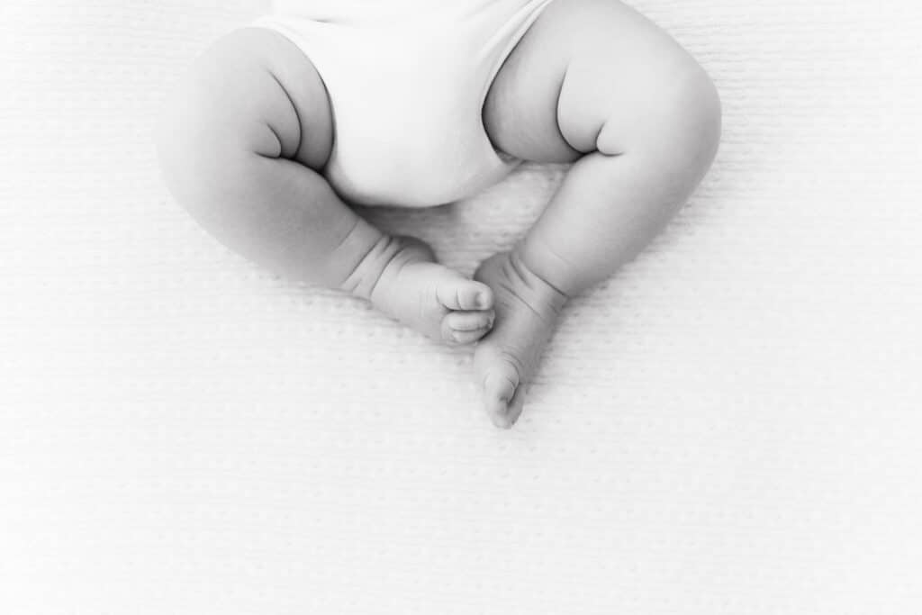 Black & White Image of newborn baby legs