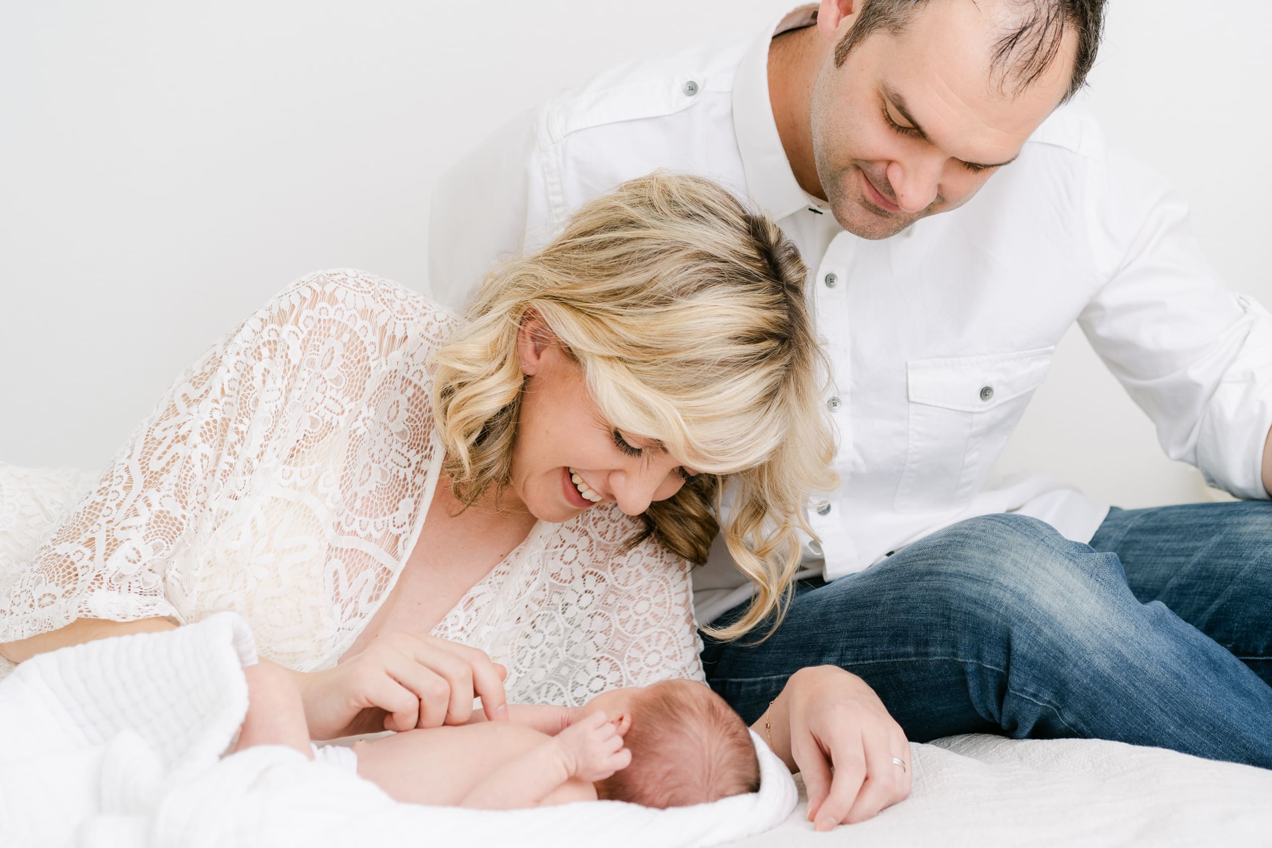 Mother and father with newborn baby in Roseville Sacramento Maternity Newborn Family Photographer