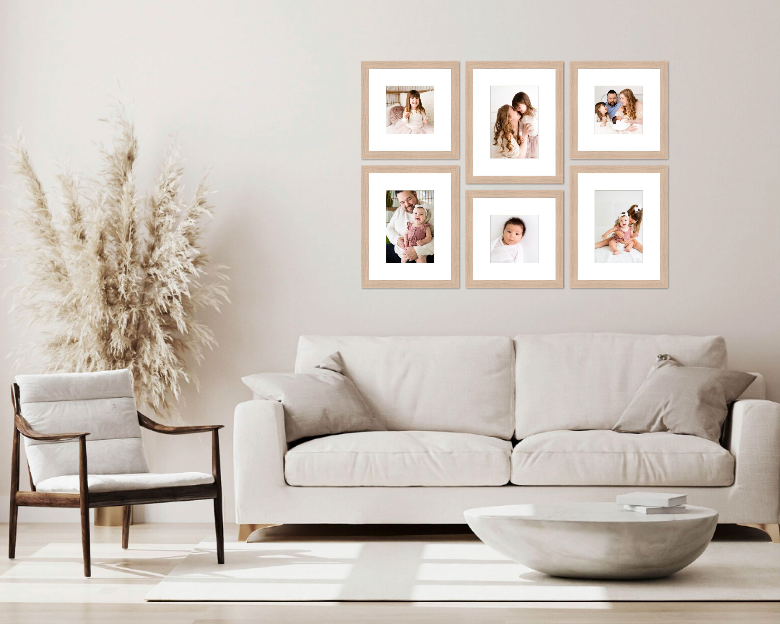 Framed fine art prints hanging in a neutral living room